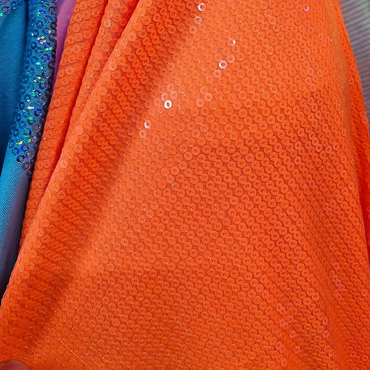 Tela con lentejuela sólida por metro, color naranja